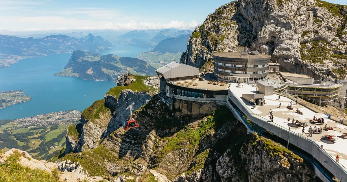 The summit buildings of Pilatus Kulm on the cliff edge above Lake Lucerne