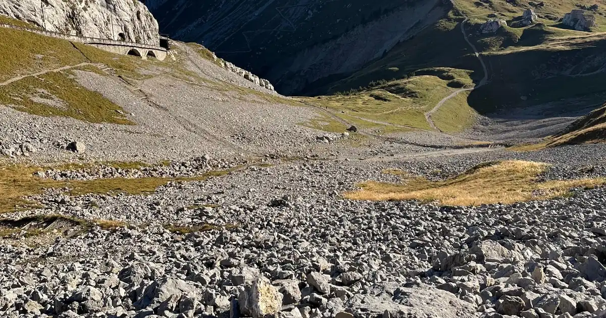 A hiking trail crossing limestone scree below the Pilatus summit ridge